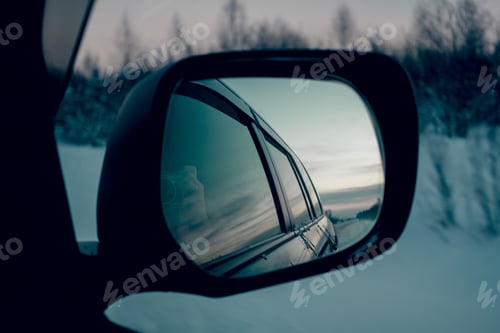 Preview: driving in winter, snowy lanscape in car mirrorr - road in snowy forest countryside
