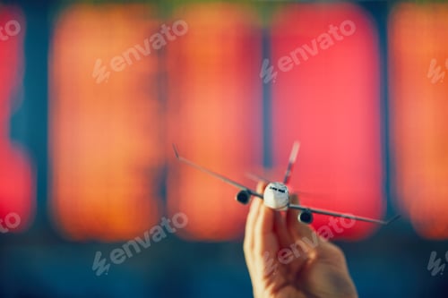 Preview: Hand is holding model airplan