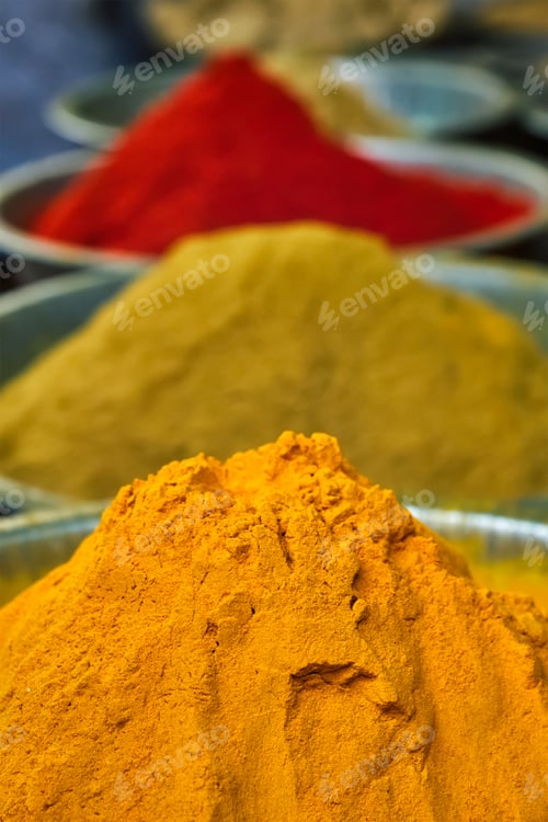 Preview: Turmeric curcuma powder and chili powder in spices market in India