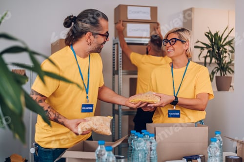 Preview: Group of volunteers working in community charity donation center