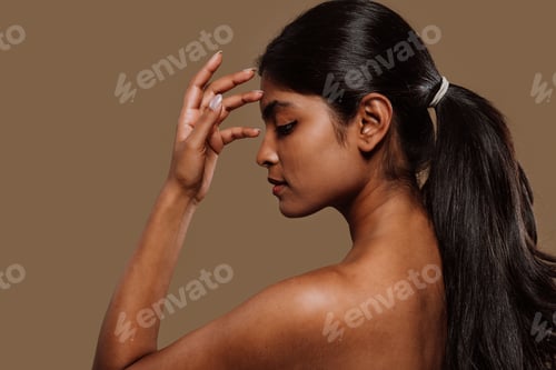 Preview: Professional beauty studio portrait on a young indian woman with long dark hair