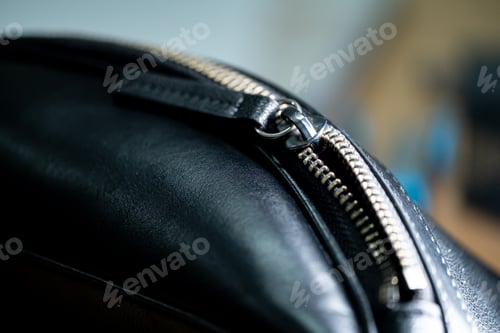 Preview: Black leather bag with silver zipper close-up