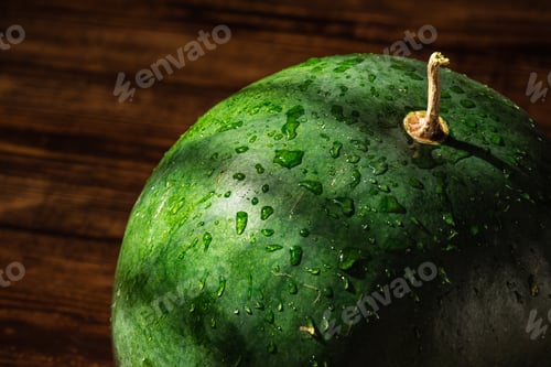 Preview: Green watermelon with sprays and shadows on peel