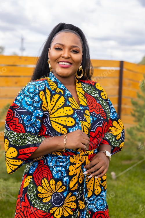 Preview: Summer portrait of beautiful african american woman in colourful dress wear standing on backyard