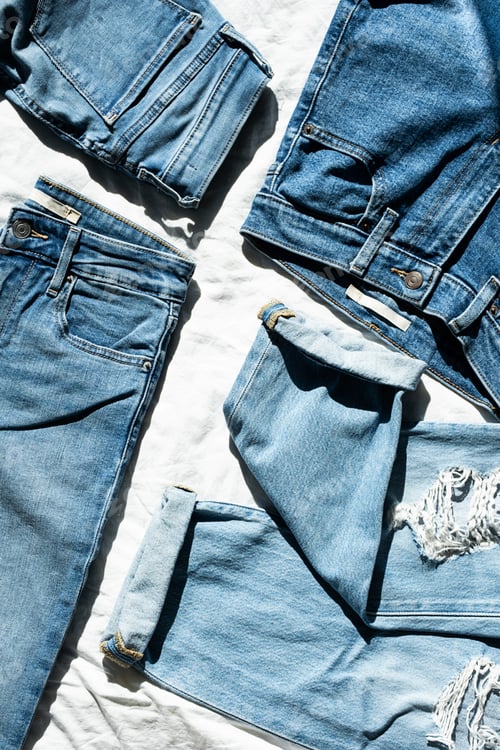 Preview: Jeans on White Textile Background, Top View.