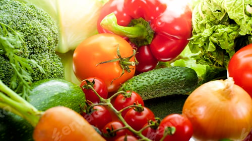 Preview: Beautiful background with sun shining on fresh ripe vegetables from garden lyign on table