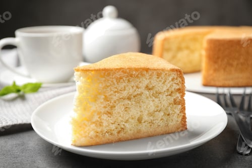 Preview: Piece of delicious fresh homemade cake on grey marble table