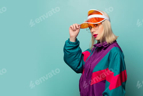 Preview: Style blonde woman in 80s glasses and hat