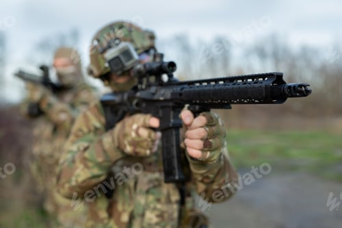 Preview: Two military man with airsoft automatic rifle.