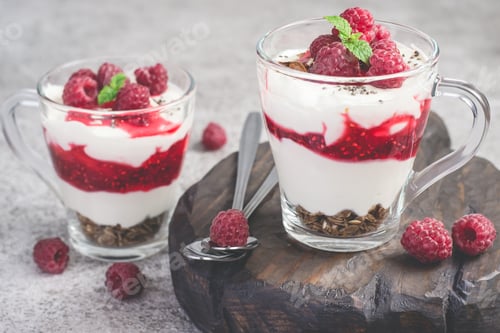 Preview: Raspberry healthy dessert or breakfast with natural yogurt in glass mugs