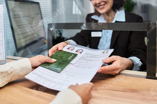 Preview: Woman Processing Visa Application Documents at Service Counter