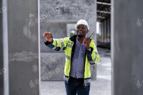 Preview: At building construction site engineer check quality precast concrete slabs and radio call to team