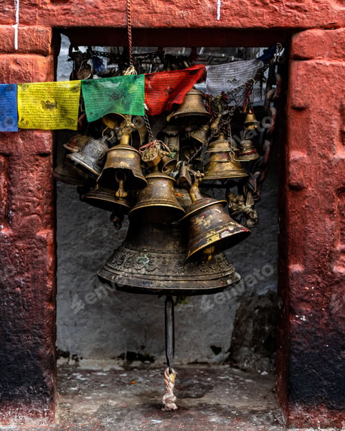 Preview: Vertical shot of Tibetan Buddhist bells and prayer flags and chimes in Kathmandu, Nepal