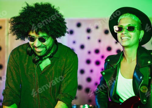 Preview: Happy young multiracial people recording new album inside music studio
