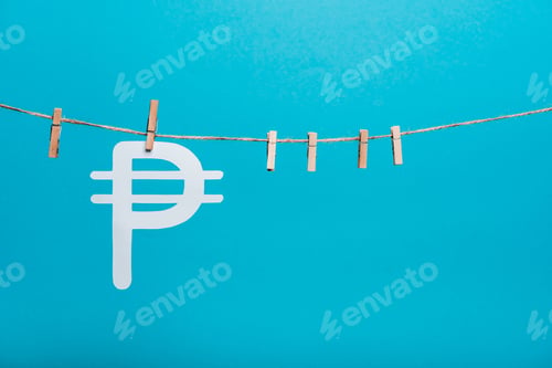 Preview: wooden cloth pins on line rope near russian money sign on blue
