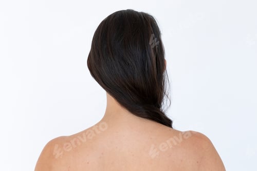 Preview: Rear view of a naked woman studio shoot