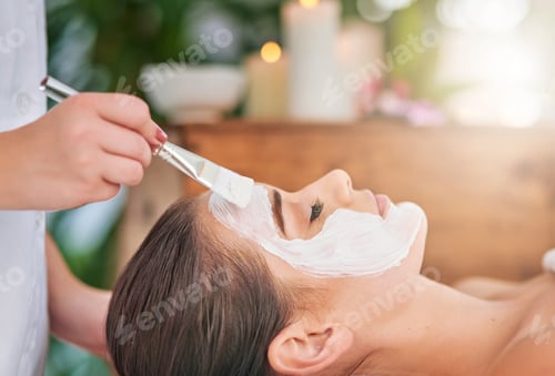 Preview: Cropped shot of an attractive young woman getting a facial treatment at a spa