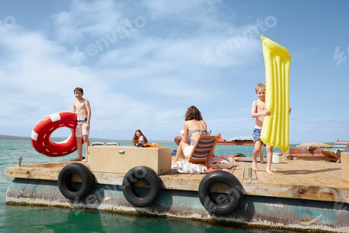 Preview: Family having fun on houseboat sun deck, Kraalbaai, South Africa