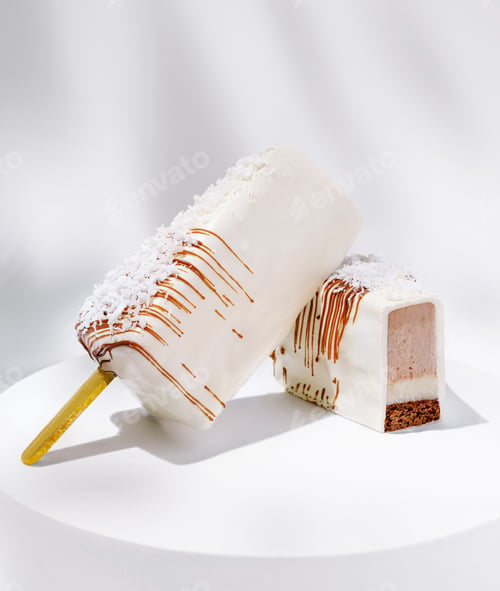 Preview: Delicious frozen dessert with creamy coating and chocolate layer on white plate