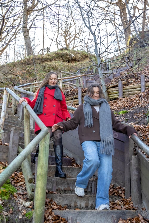 Preview: Two women walking in the park. Forest. Two women walking and talking in the park.