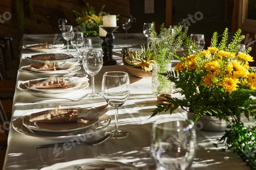Preview: Laid table with cutlery and crockery in the sunset sunlight