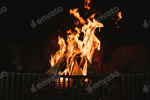 Preview: Flames in the hearth of an open fireplace, warming a family home