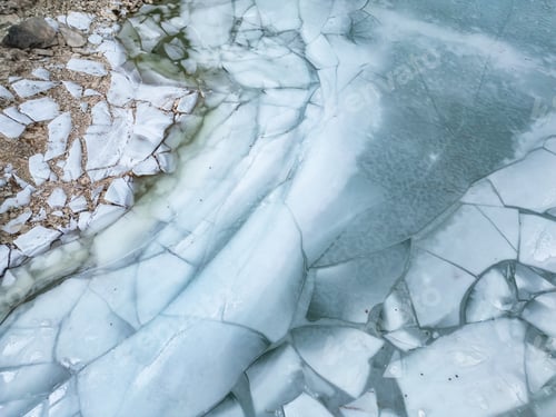 Preview: Ice at the lake by rocky shore. Aerial View. British Columbia landscape. Canada
