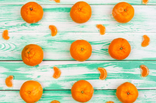Preview: tangerines on a black wooden background, space for text