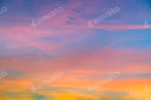Preview: Beautiful shot of pink clouds in a clear blue sky with a scenery of sunrise