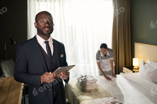 Preview: African American Hotel Manager Checking Rooms