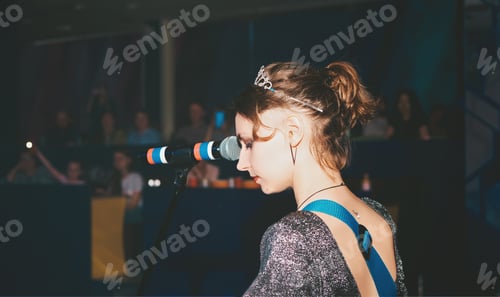 Preview: female caucasian singer performing a song on a stage. singing woman,