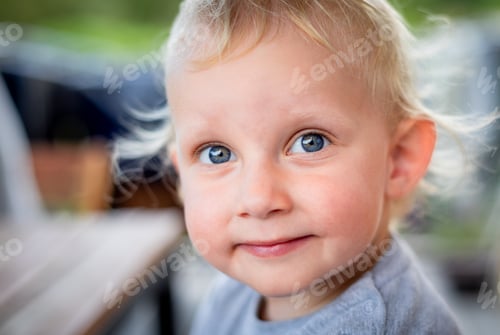 Preview: Portrait of cute little child boy with blond hair and blue grey eyes