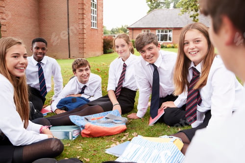 Preview: Teenage Students In Uniform Working On Project Outdoors