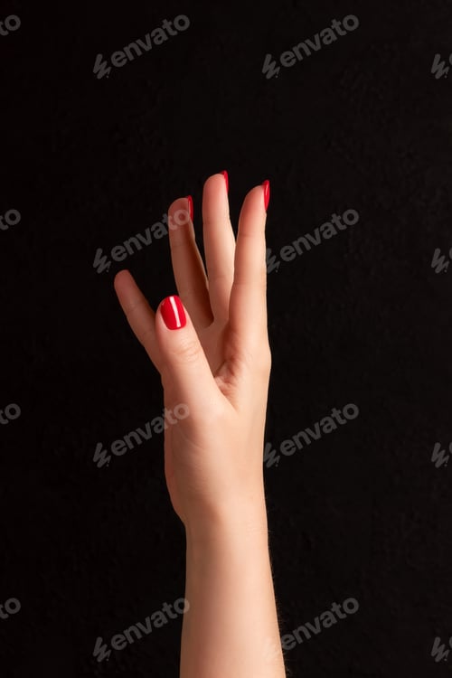 Preview: Female hand with red nails