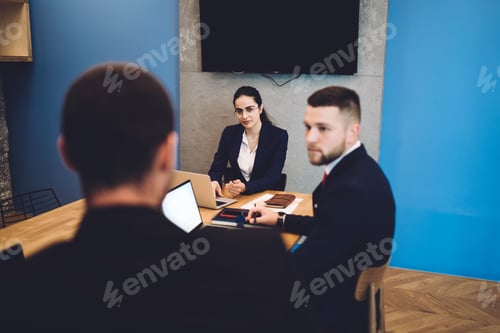 Preview: Serious businesspeople having meeting in office