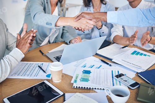 Preview: Business people giving handshake for success and support in finance meeting with report, teamwork c