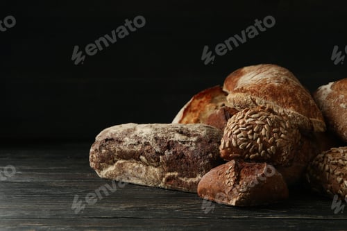 Preview: Different fresh bakery products on wooden background
