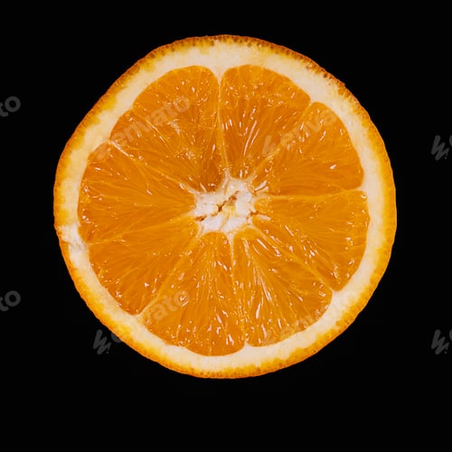 Preview: Half an orange levitating on black background.