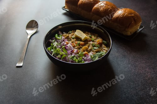 Preview: Close up of popular street food snacks pav bhaji in a bowl.