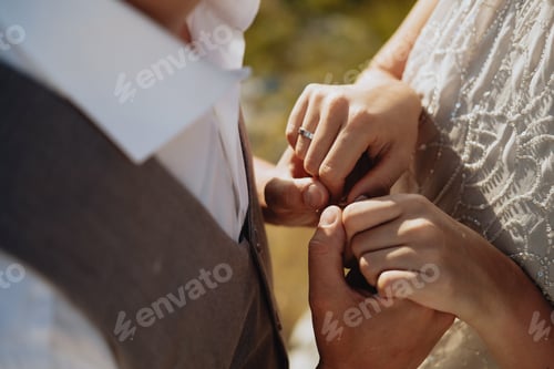 Preview: Young couple in love holding hands