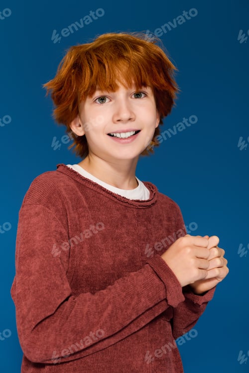Preview: Bright moments captured in a studio with a cheerful redhead boy showcasing casual fashion