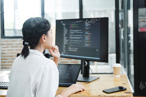 Preview: IT Programmer Starts Working on Desktop Computer.