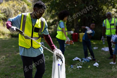 Preview: Multi-generation mixed race family collecting garbage