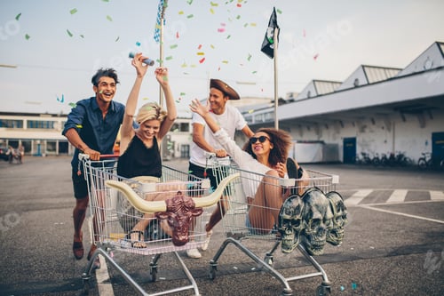Preview: Young friends racing with shopping carts
