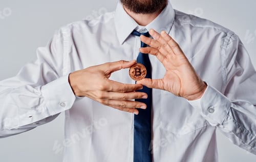 Preview: Bitcoin coin in the hands of a business man managed to currency cryptocurrency