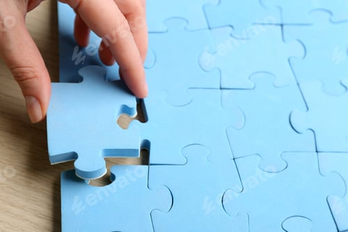 Preview: Woman putting light blue puzzle piece, closeup with space for text. Career promotion concept