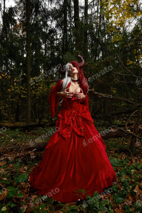 Preview: Stylish and fashionable model girl in the image of Maleficent posing among mystic forest - fairytale