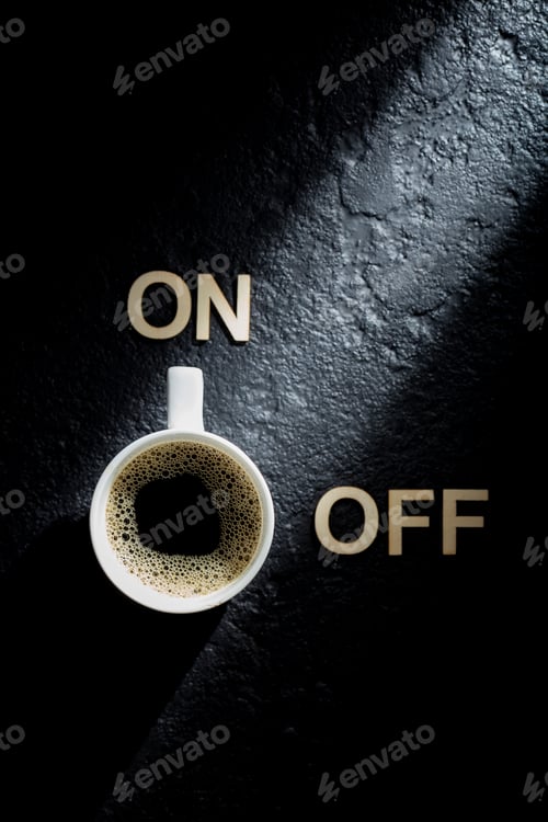 Preview: Espresso cup on black background, concept of "coffee activates you"
