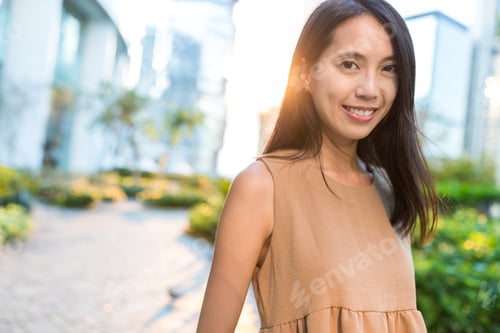 Preview: Asian woman under sunset
