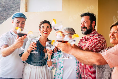 Preview: mixed ages group of caucasian people having fun together celebrating